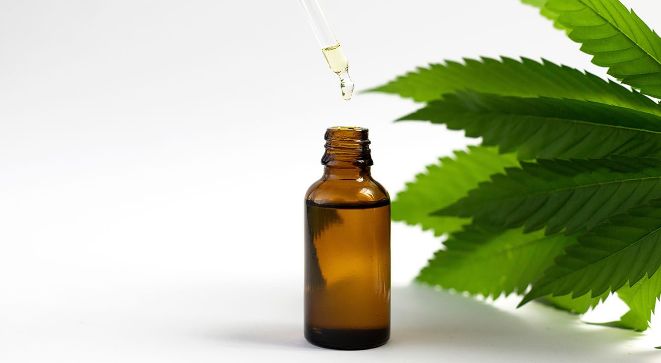 CBD oil and a cannabis leaf