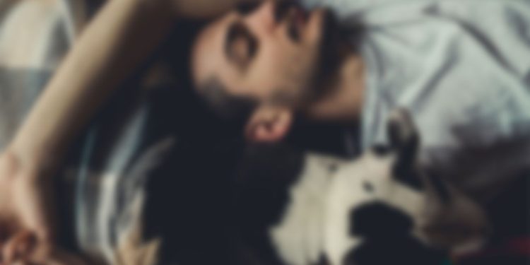 Man sleeping with a dog